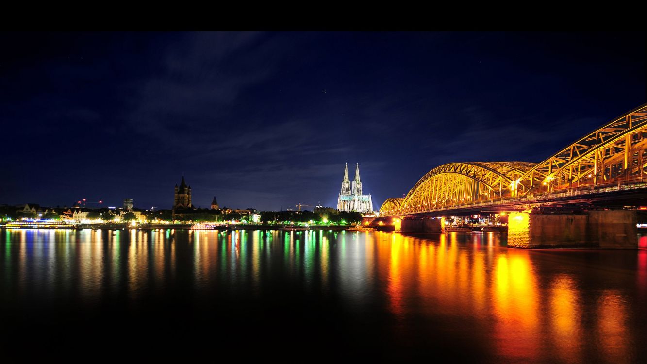 body of water near bridge during night time