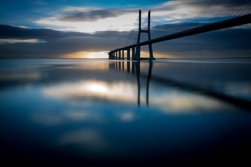 Image bridge over water during night time