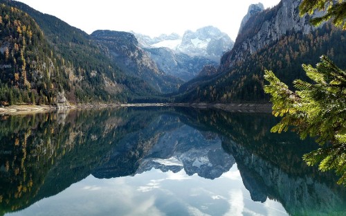 Image green mountains beside lake during daytime